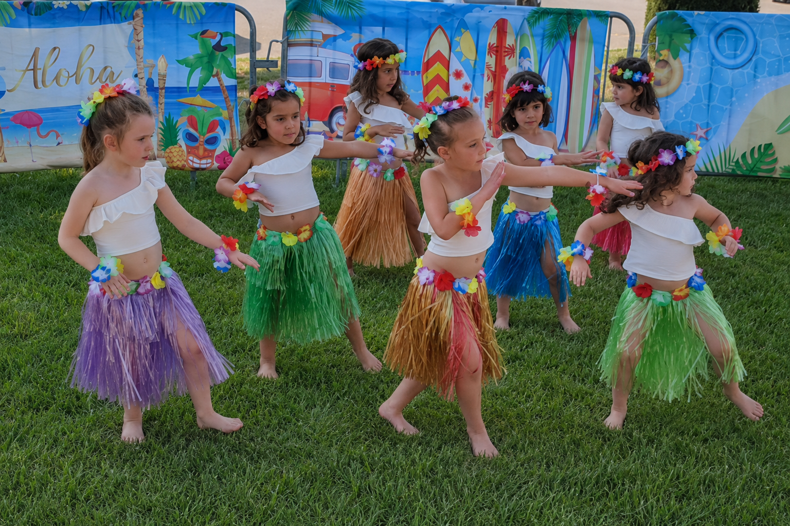 Children performing a Hawaiian cultural dance together at Global Children School