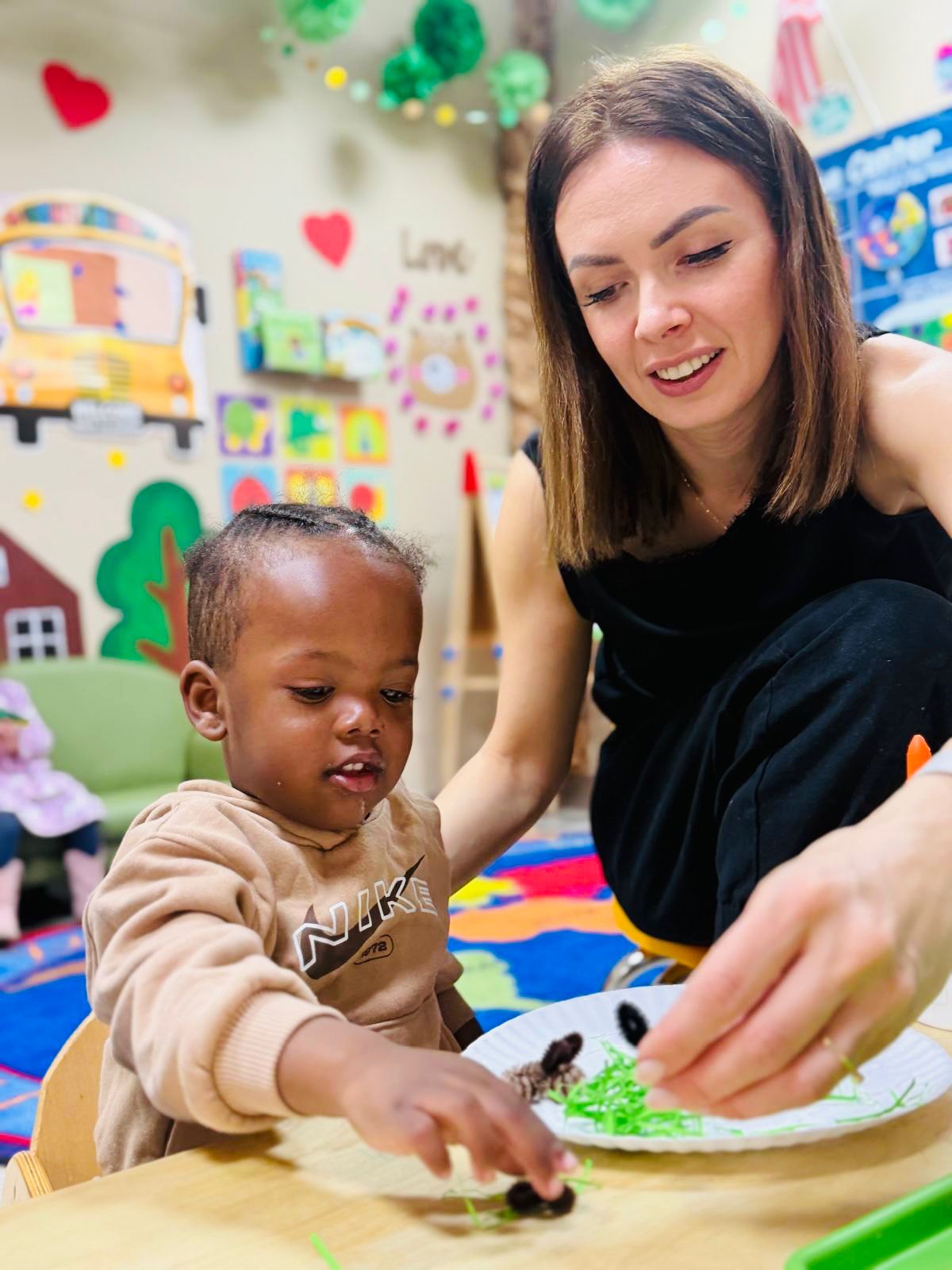 Global Children School teacher supporting a young learner