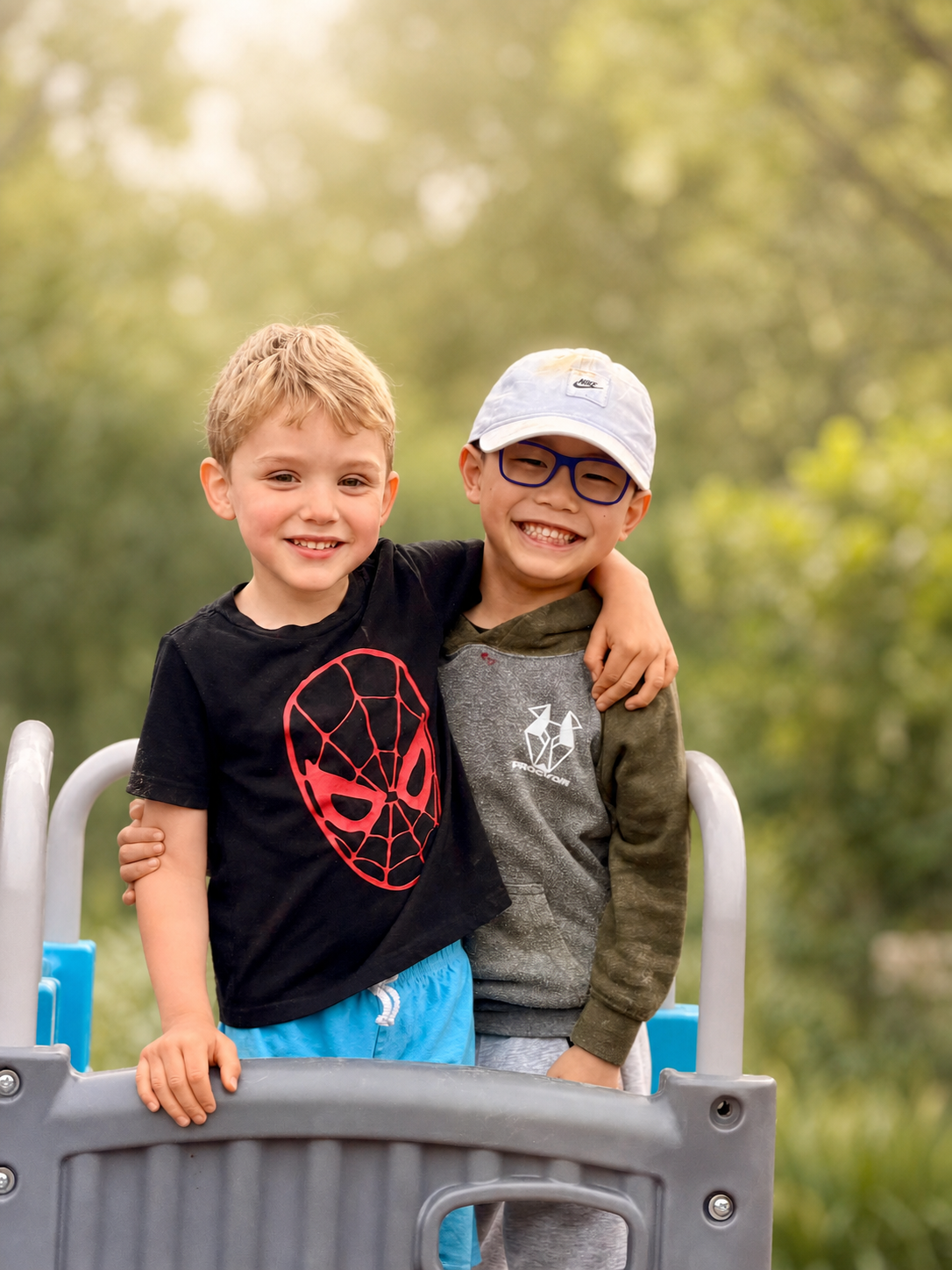 Two Global Children School friends smiling together outdoors