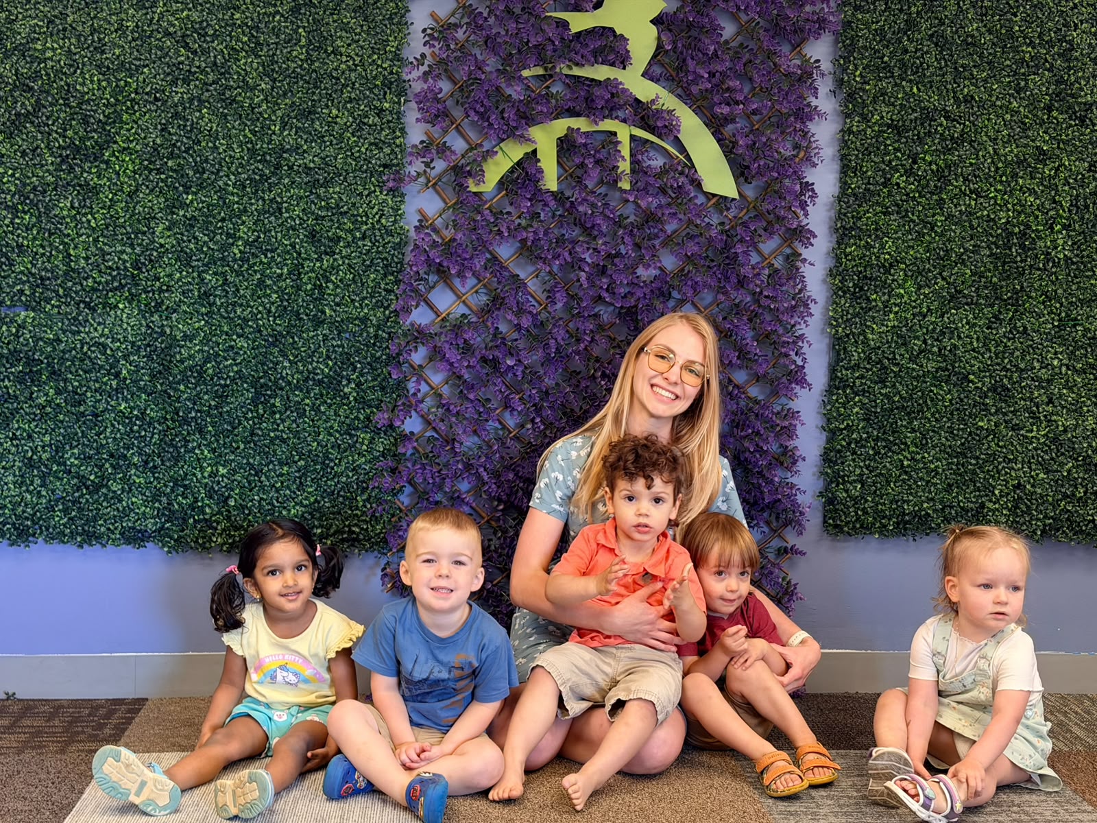 A GCS teacher surrounded by her toddler class
